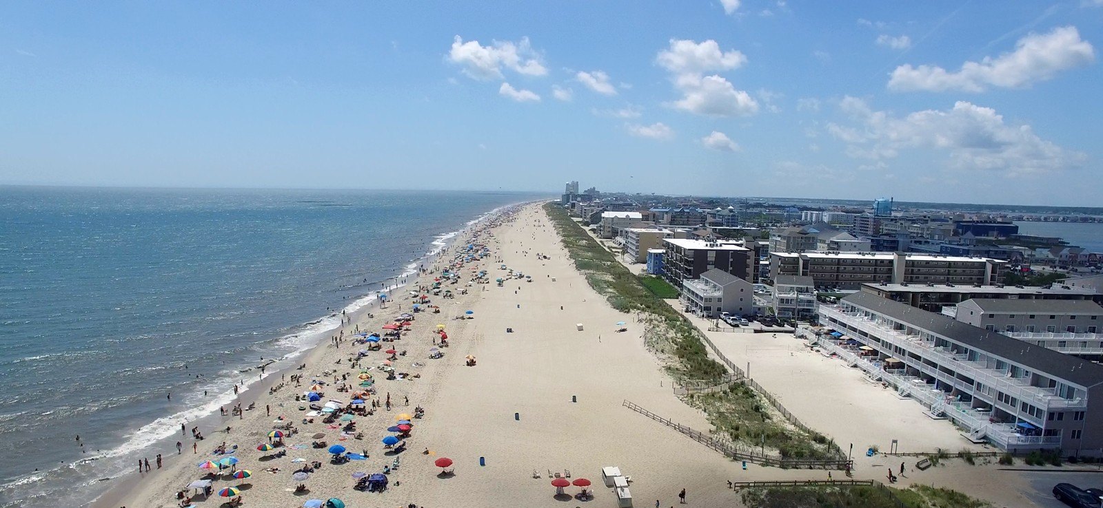 Aerial view of Ocean City, Maryland's beach and boardwalk on a sunny day